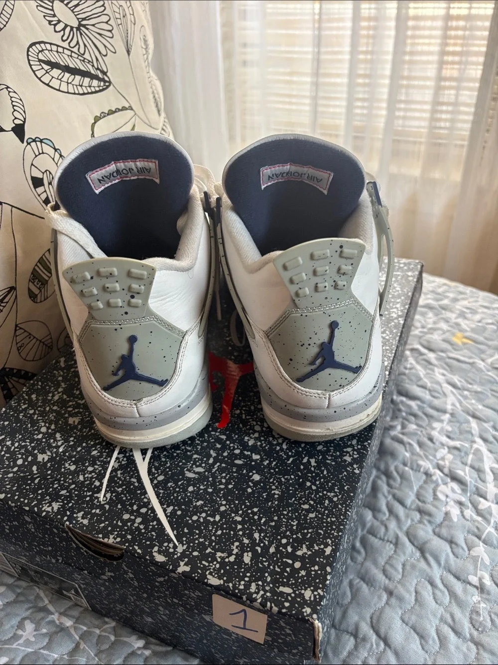 Nike White and Navy Air Jordan 4 Retro Sneakers